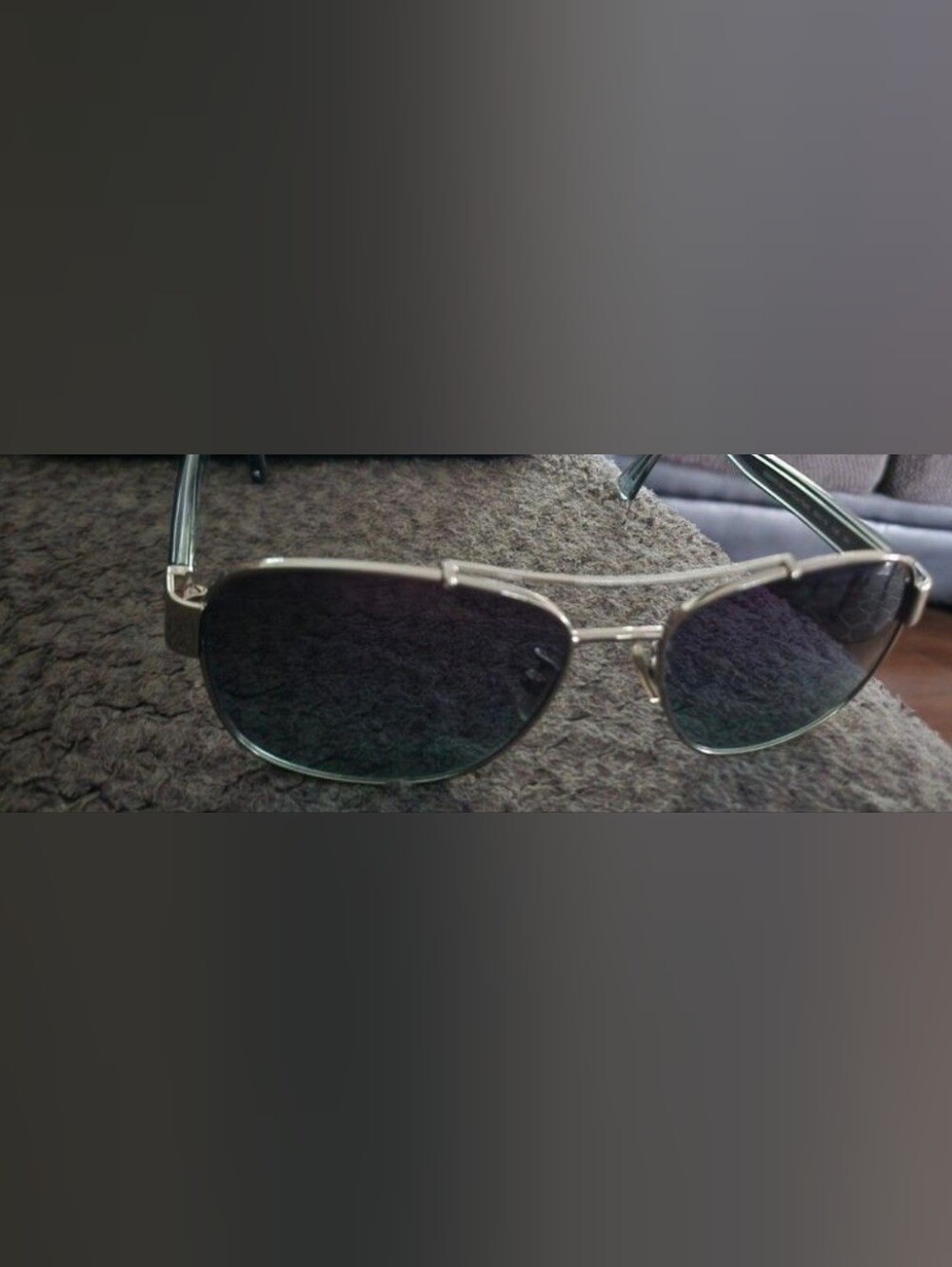 Womans Silver Aviator Coach Sunglasses with Dark Lenses